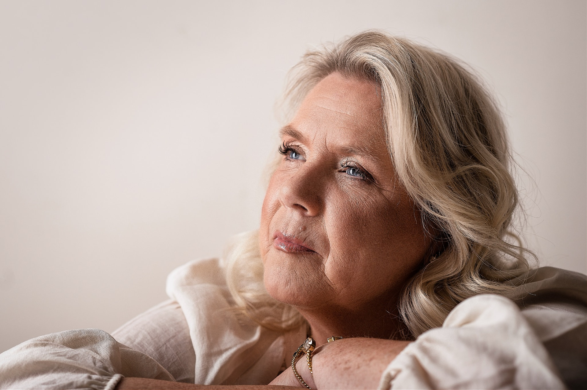 Camilla resting quietly, looking toward the light